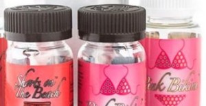 Bottles of tanning and skincare products on display.