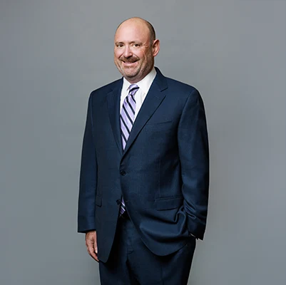 Professional man in a suit with a tie posing confidently