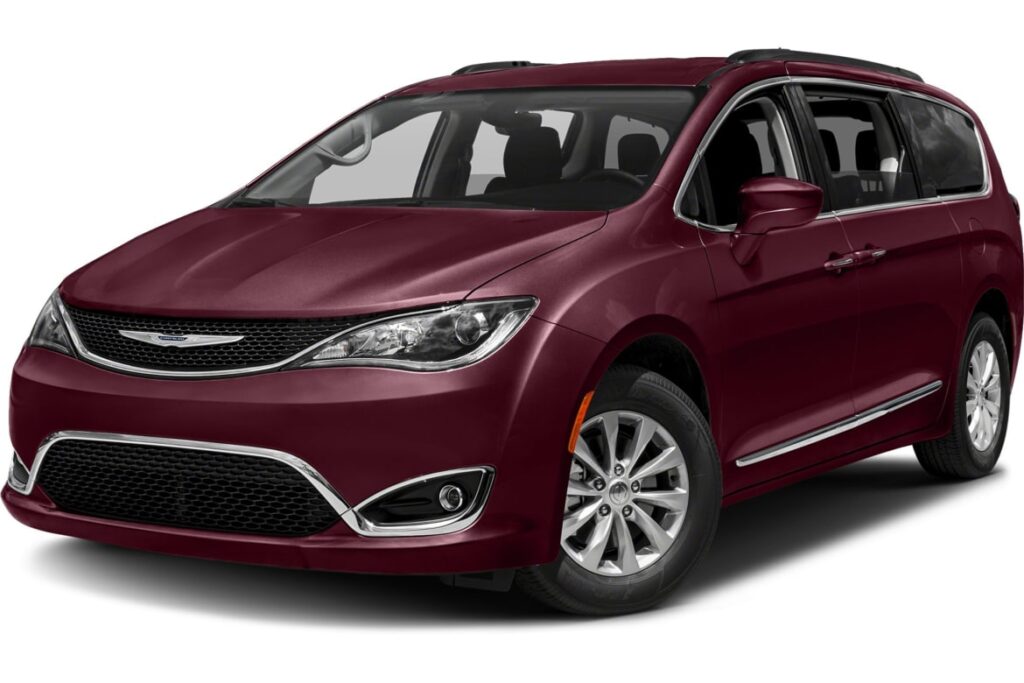 Maroon Chrysler minivan parked in an outdoor setting.