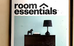 Room essentials poster featuring a lamp and decorative items
