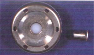Close-up view of a metal component with a hollow center.