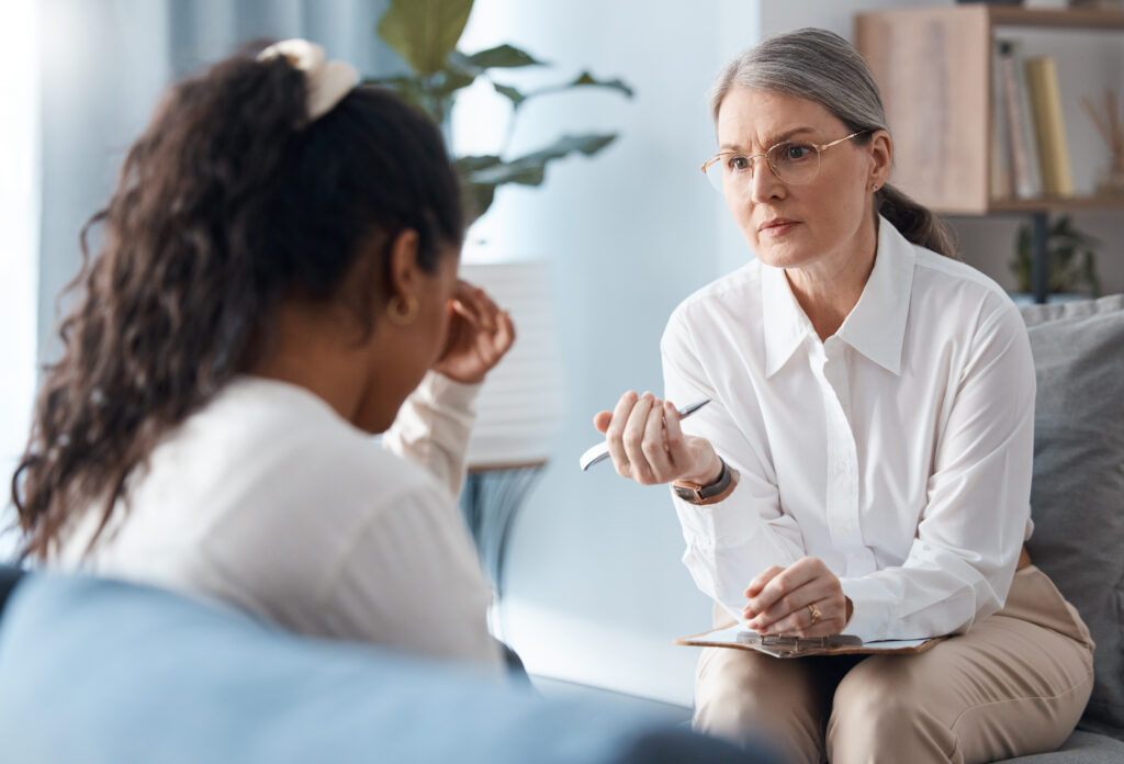 A counselor listens closely during a supportive conversation about childhood sexual abuse and the Pennsylvania lookback window for legal claims.